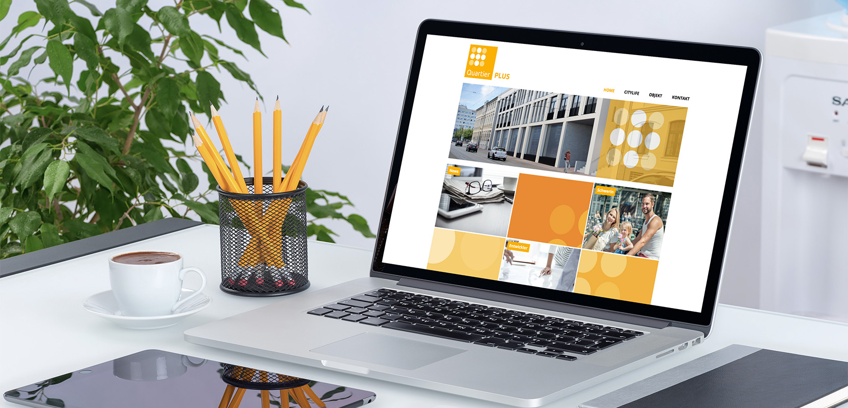 Quartier PLUS Startseite auf Laptop